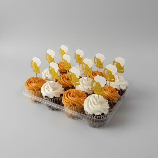 Cupcakes with beer-themed decorations in a clear container.