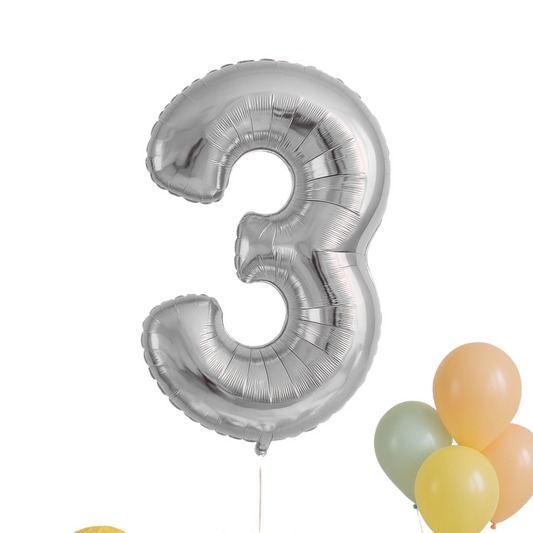 Silver number 3 balloon with other balloons on a white background