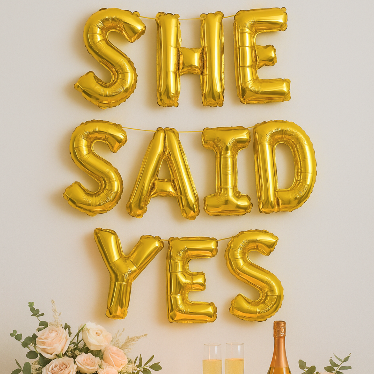 Foil letter balloons spelling She Said Yes for engagement or proposal party decor