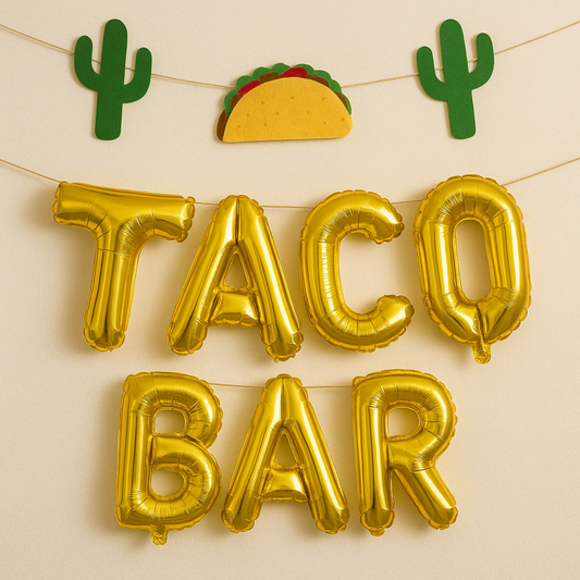 Gold balloon letters spelling 'TACO BAR' with cactus and taco decorations on a beige background