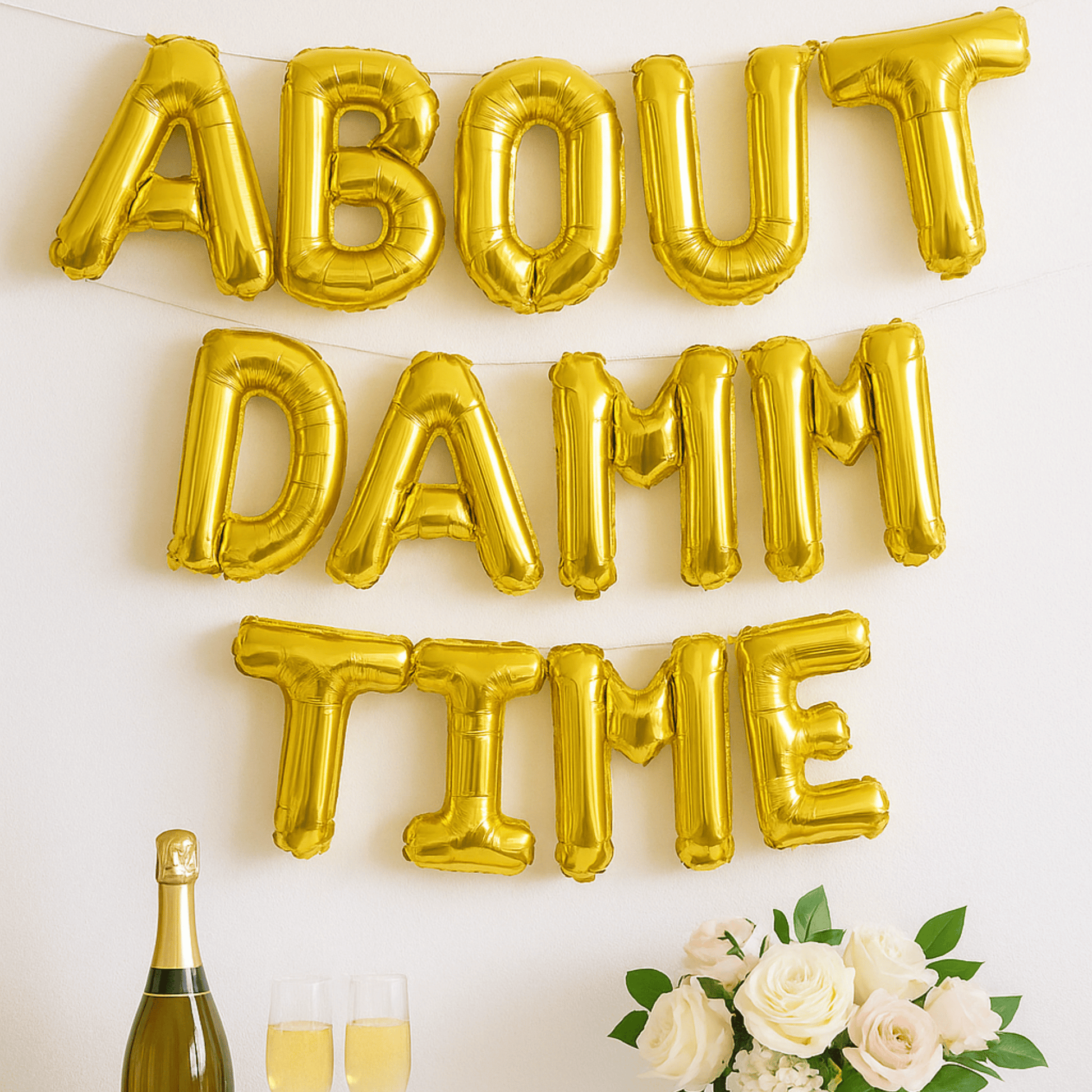 Gold foil balloon banner spelling About Damn Time for engagement or bridal party