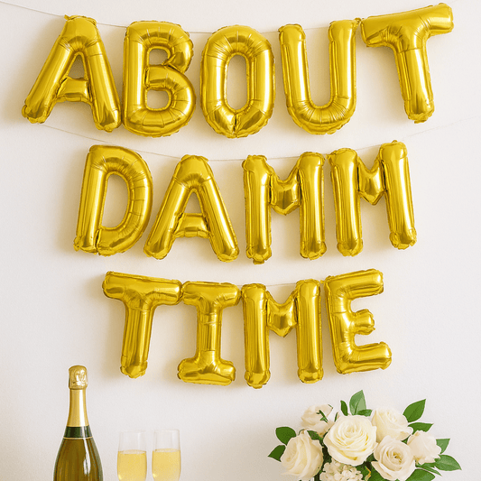 Gold foil balloon banner spelling About Damn Time for engagement or bridal party