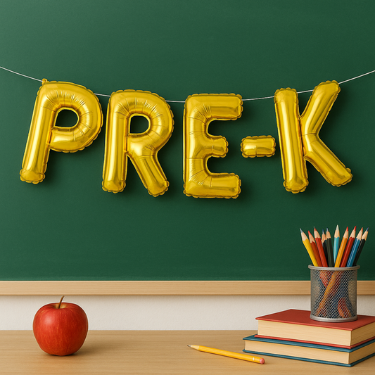 Main photo with foil balloons styled against a classroom or chalkboard backdrop