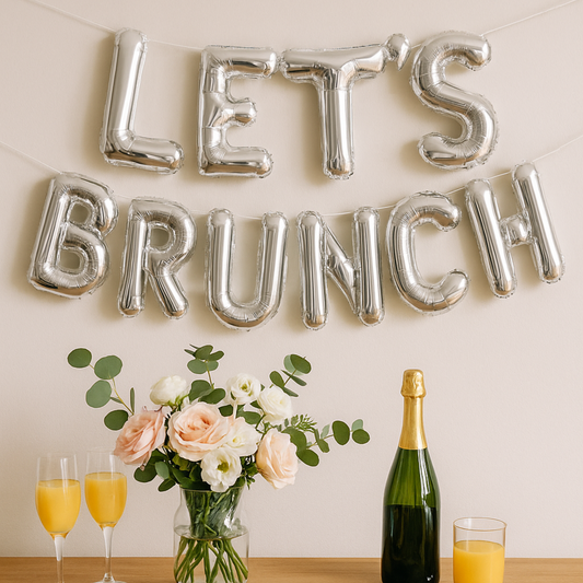 Let’s Brunch silver foil balloon banner for mimosa brunch backdrop