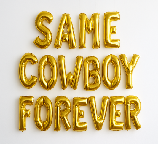 Gold balloon letters spelling 'SAME COWBOY FOREVER' on a white background