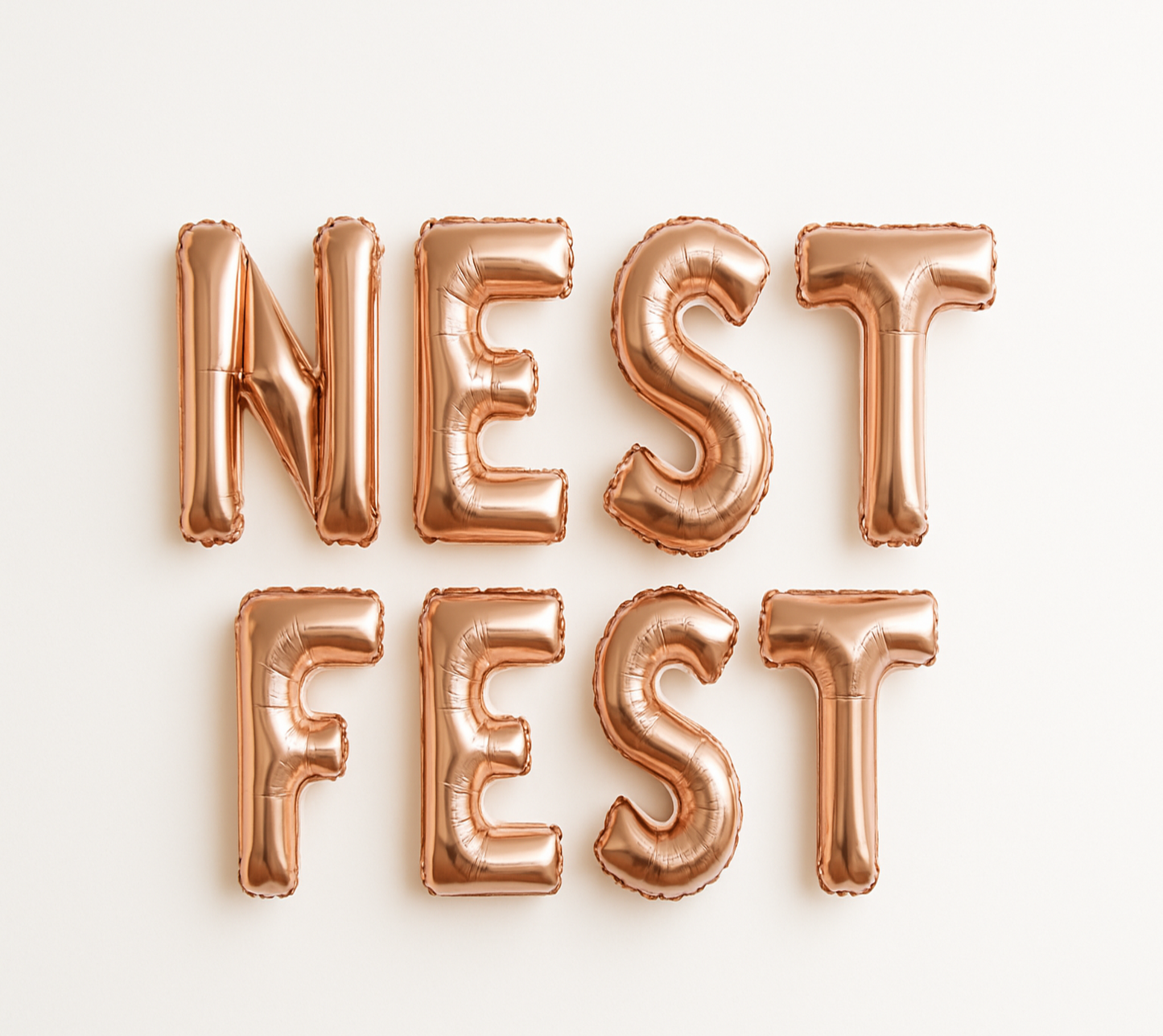 NEST FEST in rose gold foil letter balloons
