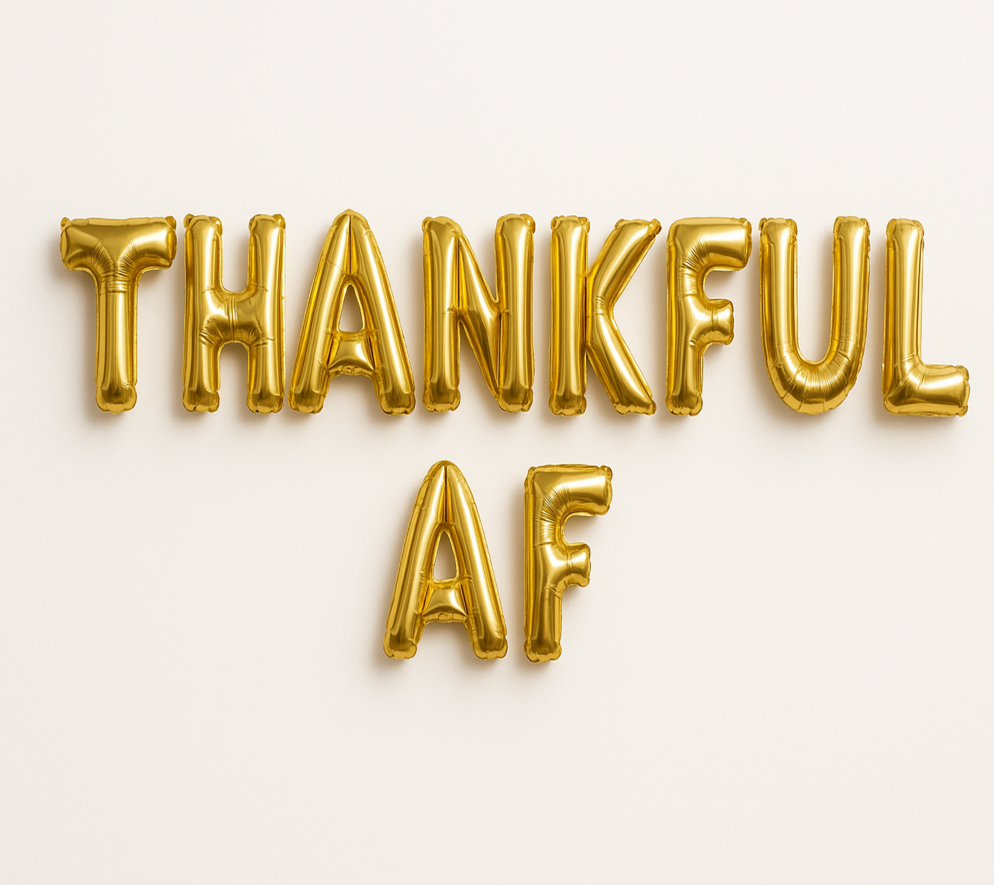 THANKFUL AF in gold foil letter balloons