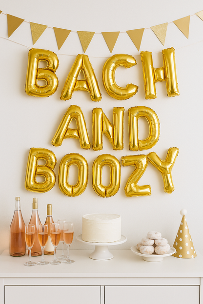 Gold foil 'Bach and Boozy' balloons hanging as party backdrop