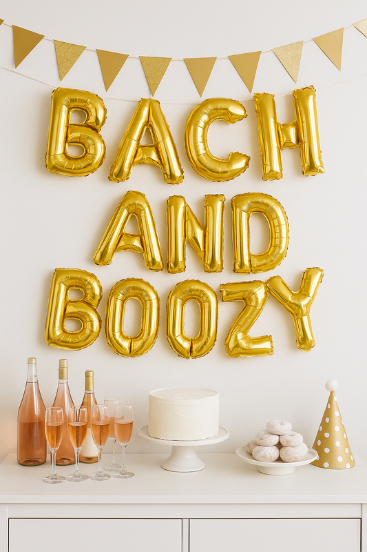 Gold foil 'Bach and Boozy' balloons hanging as party backdrop