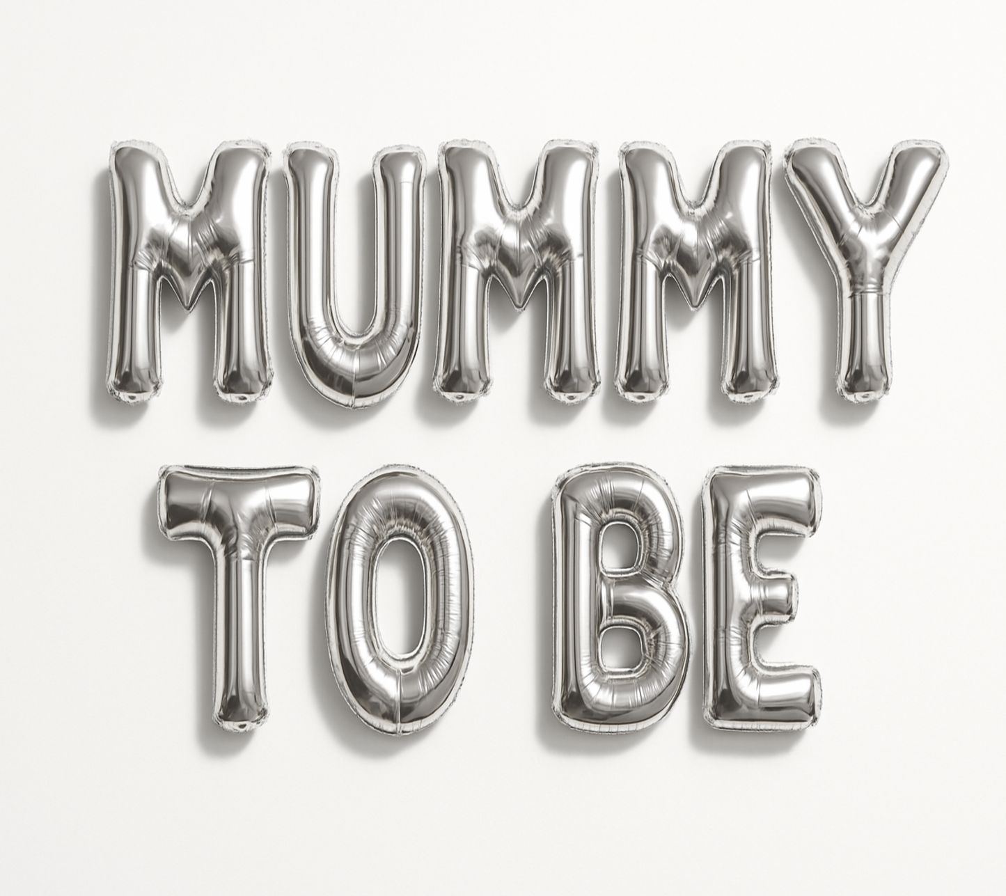 Silver 'MUMMY TO BE' balloon letters on a white background