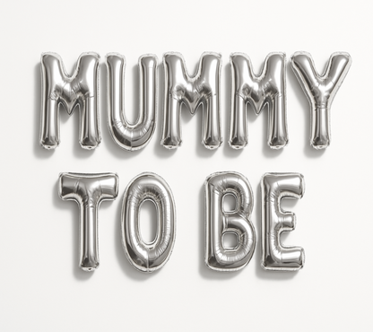 Silver 'MUMMY TO BE' balloon letters on a white background