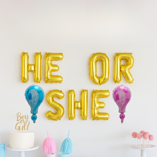 Gender reveal party setup featuring 'He or She' balloon banner