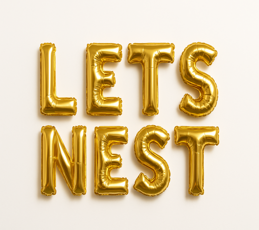 LETS NEST in gold foil letter balloons 
