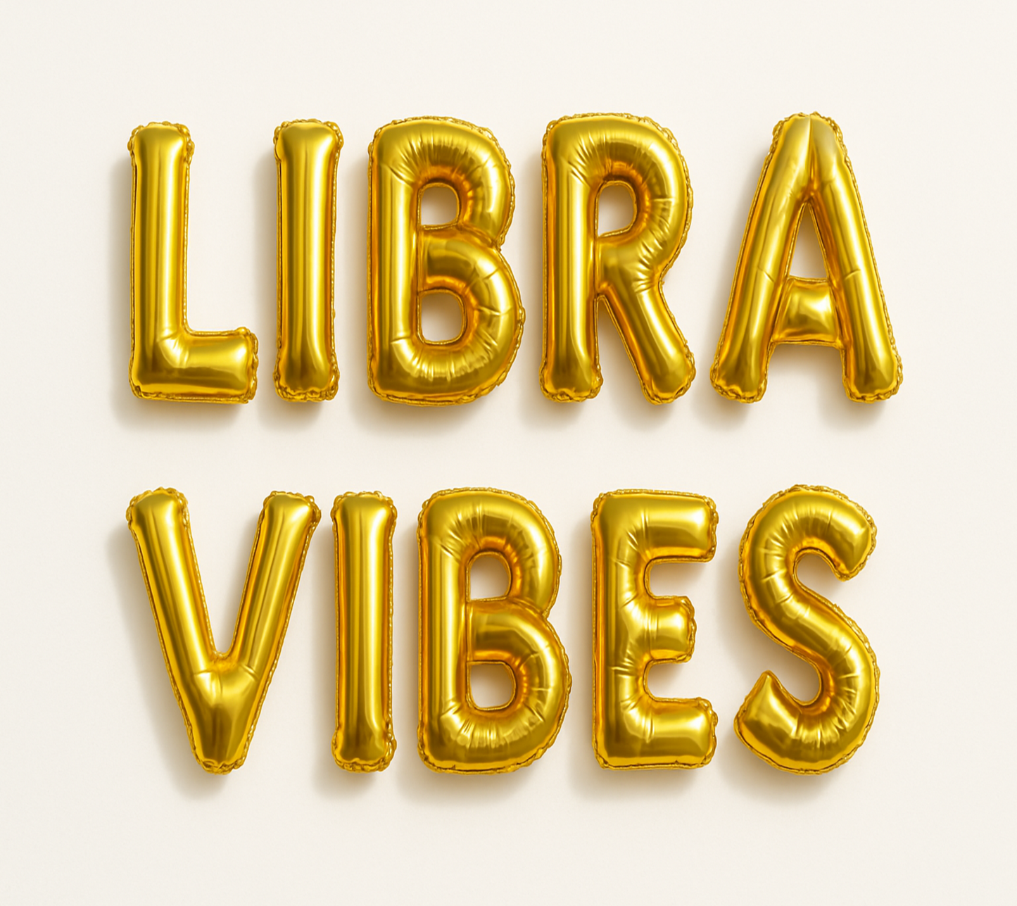 LIBRA VIBES in gold foil letter balloons 
