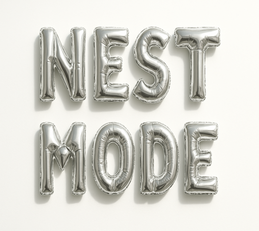 NEST MODE in silver foil letter balloons 
